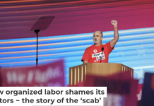 United Auto Workers President Shawn Fain wears a shirt reading ‘Trump is a Scab’ at the Democratic National Convention on Aug. 19, 2024. Andrew Harnik/Getty Images